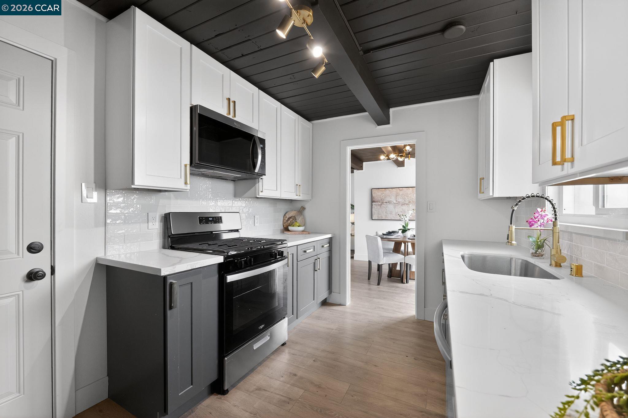 1838 Overhill Road Concord, CA 94520 - Photo 7 of 25 a kitchen with stainless steel appliances granite countertop a sink stove microwave and refrigerator
