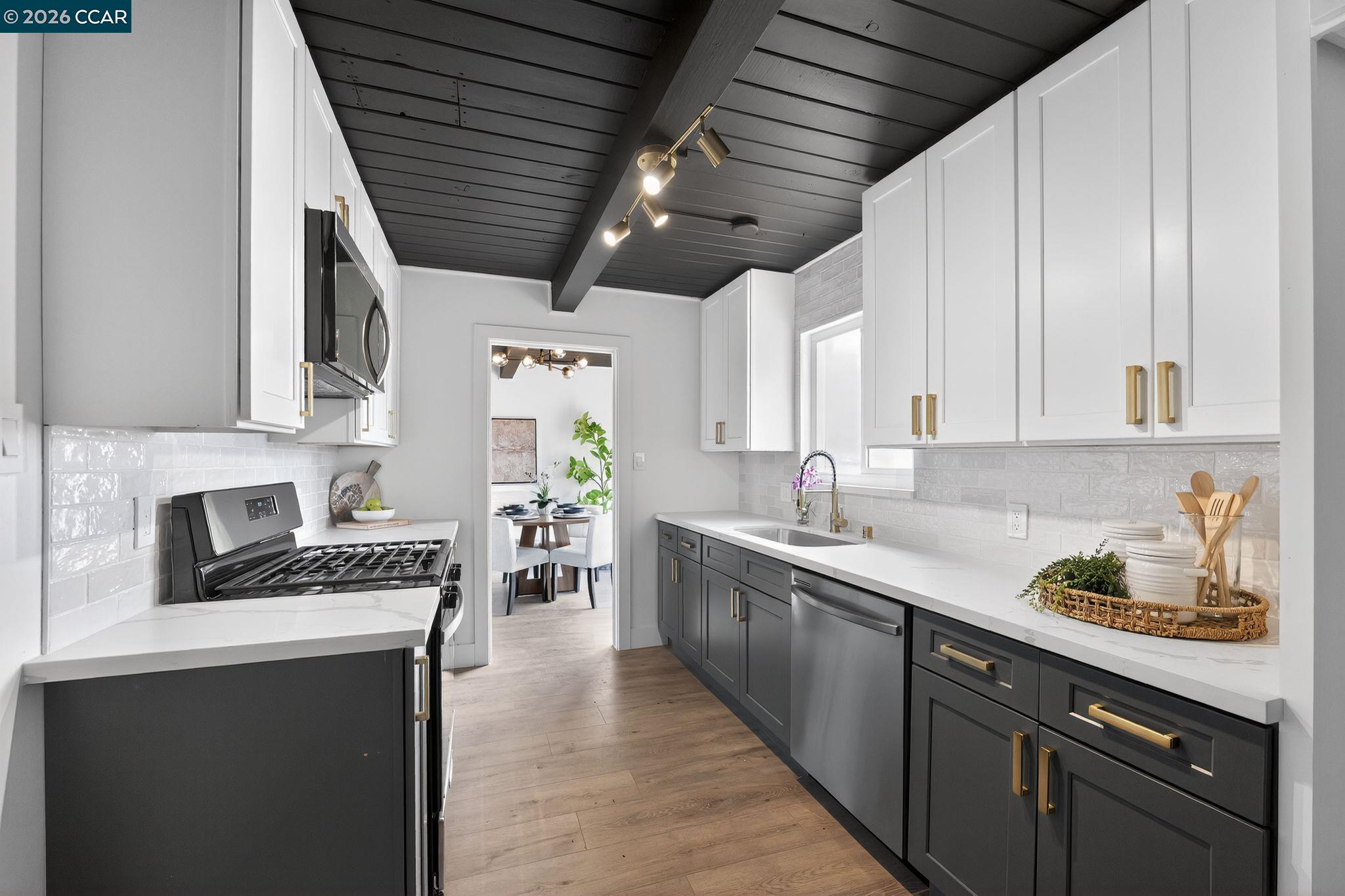 1838 Overhill Road Concord, CA 94520 - Photo 8 of 25 a kitchen with stainless steel appliances kitchen island granite countertop a sink a stove and cabinets