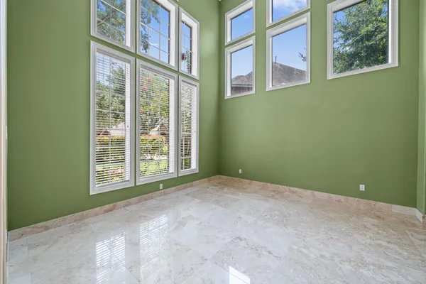 a view of an empty room with a window