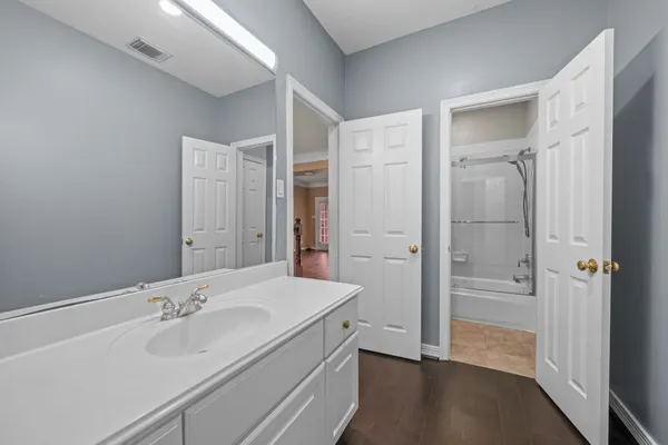 a bathroom with a sink and a mirror