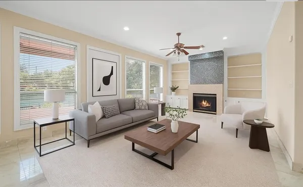 a living room with furniture and a fireplace