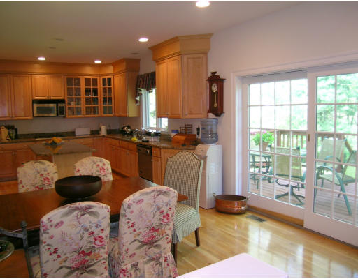 43 Newbrook Circle Newton, MA 02467 - Photo 11 of 14 a kitchen with granite countertop a stove a sink and a refrigerator