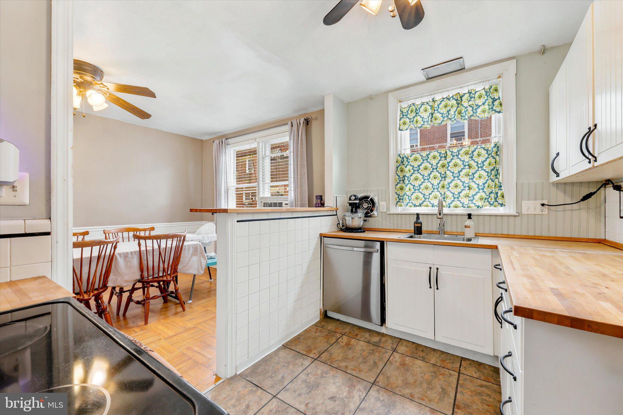 115 Academy Lane Upper Darby, PA 19082 - Photo 10 of 25 a kitchen with a sink cabinets and window
