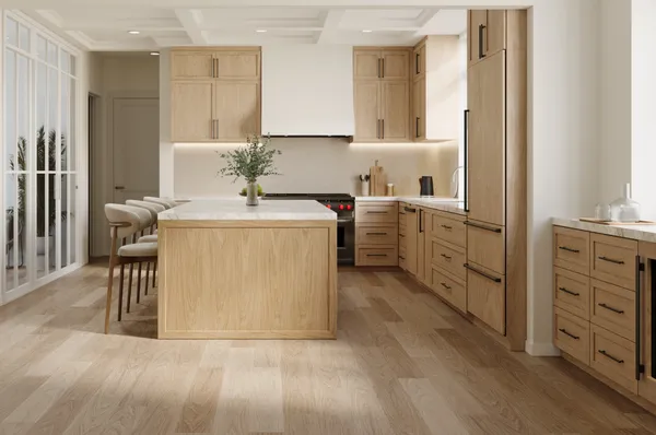 a utility room with cabinets washer and dryer