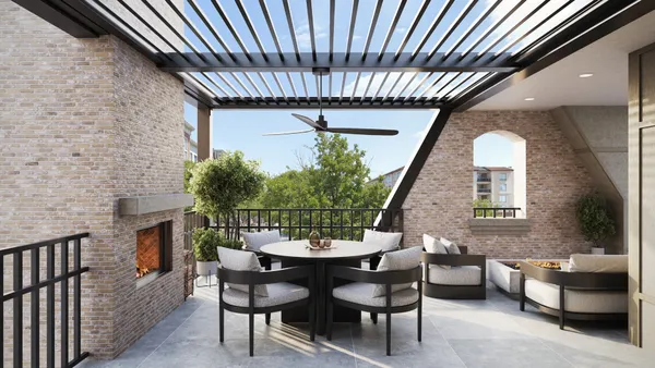 a dining room with furniture and a garden view