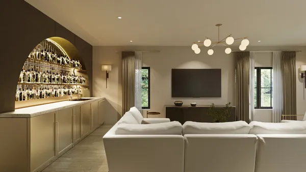 a living room with furniture a chandelier and a painting