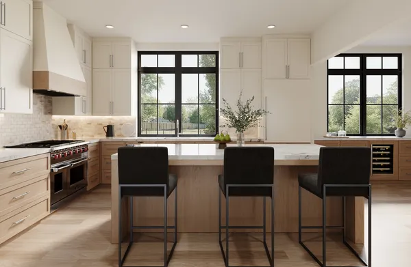 a kitchen with stainless steel appliances granite countertop a stove top oven a sink a dining table and chairs