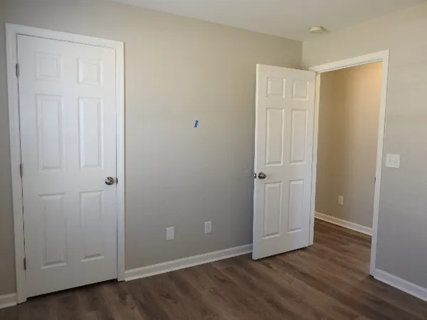 an empty room with wooden floor