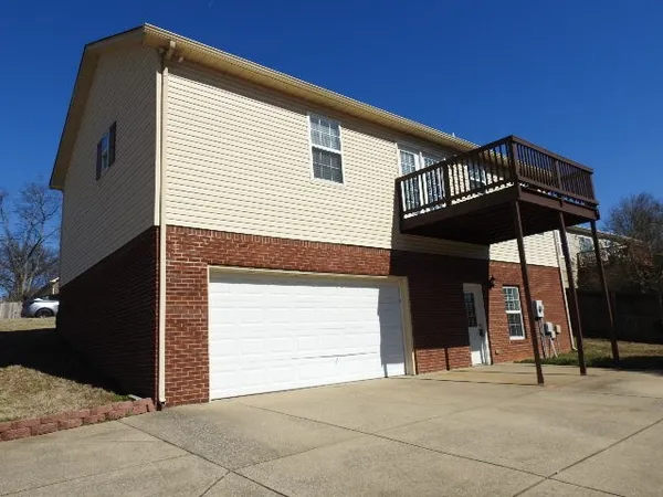 a view of a house with a parking space