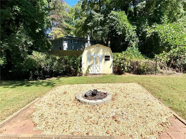 a view of pool with yard