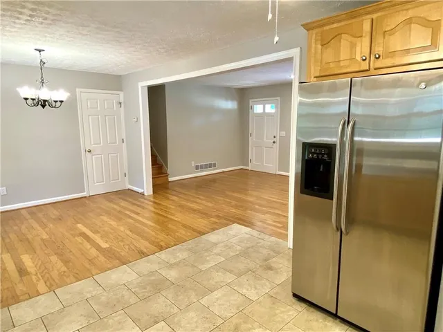 a view of a kitchen with a refrigerator