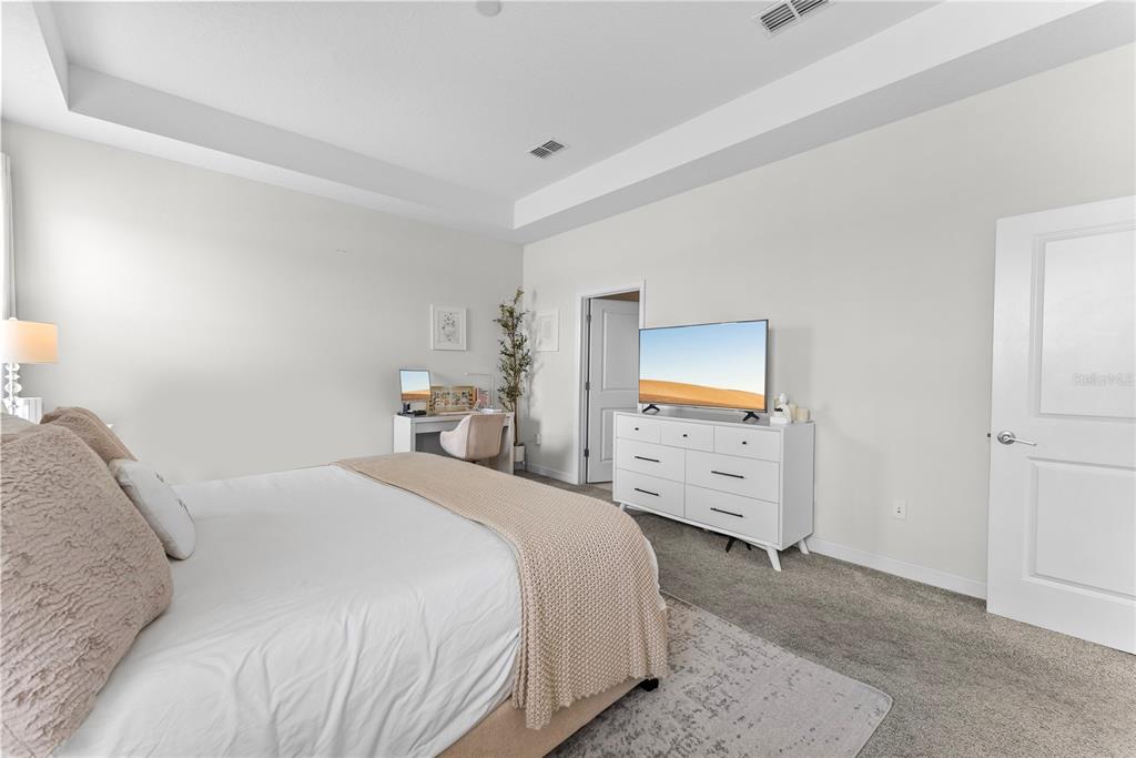 2926 Wordsmith Road Kissimmee, FL 34746 - Photo 29 of 42 a bedroom with a bed and a tv