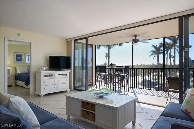 a bedroom with furniture and a flat screen tv