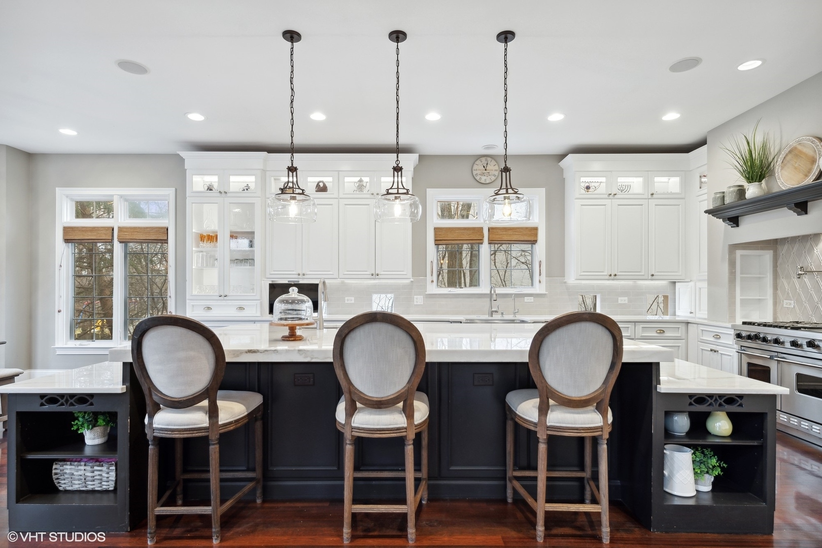 3825 Oak Avenue Northbrook, IL 60062 - Photo 11 of 56 a kitchen with stainless steel appliances a table chairs and a wooden floor