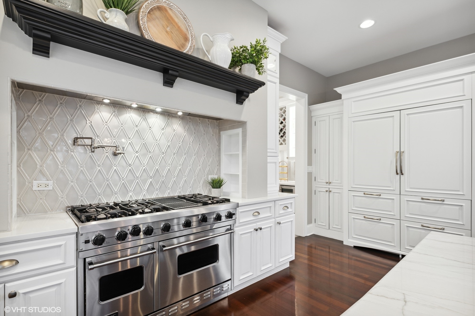 3825 Oak Avenue Northbrook, IL 60062 - Photo 12 of 56 a kitchen with stainless steel appliances a stove and white cabinets