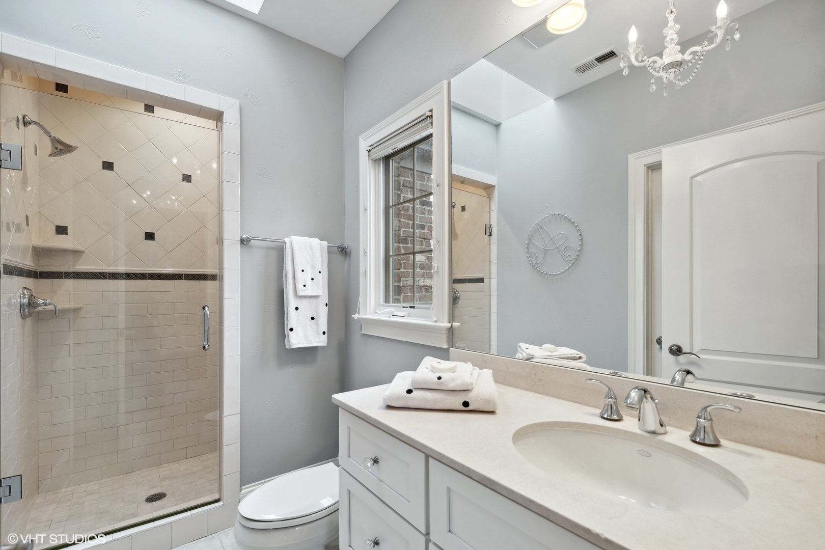 3825 Oak Avenue Northbrook, IL 60062 - Photo 26 of 56 a bathroom with a sink a toilet and shower