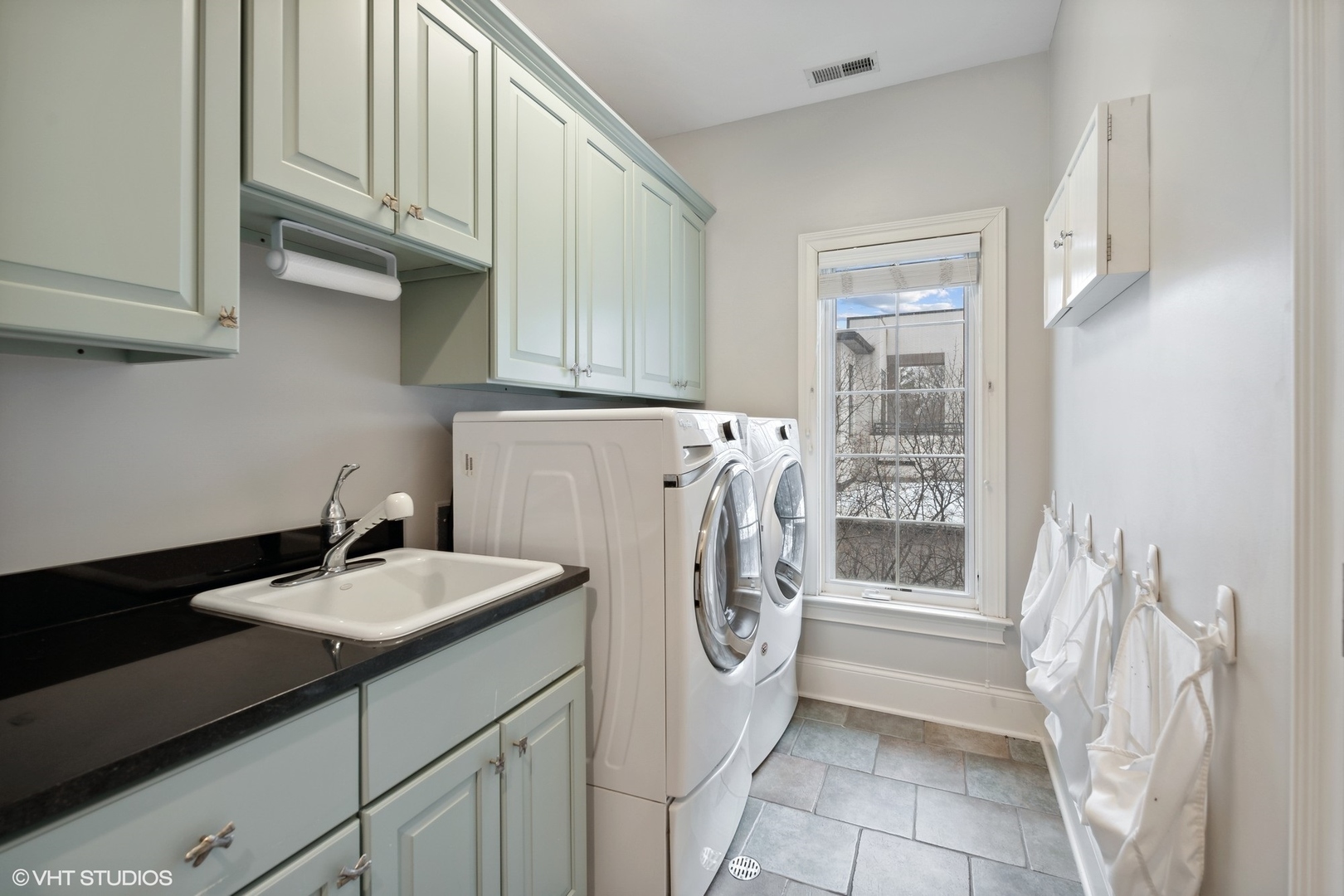 3825 Oak Avenue Northbrook, IL 60062 - Photo 31 of 56 a utility room with cabinets washer and dryer