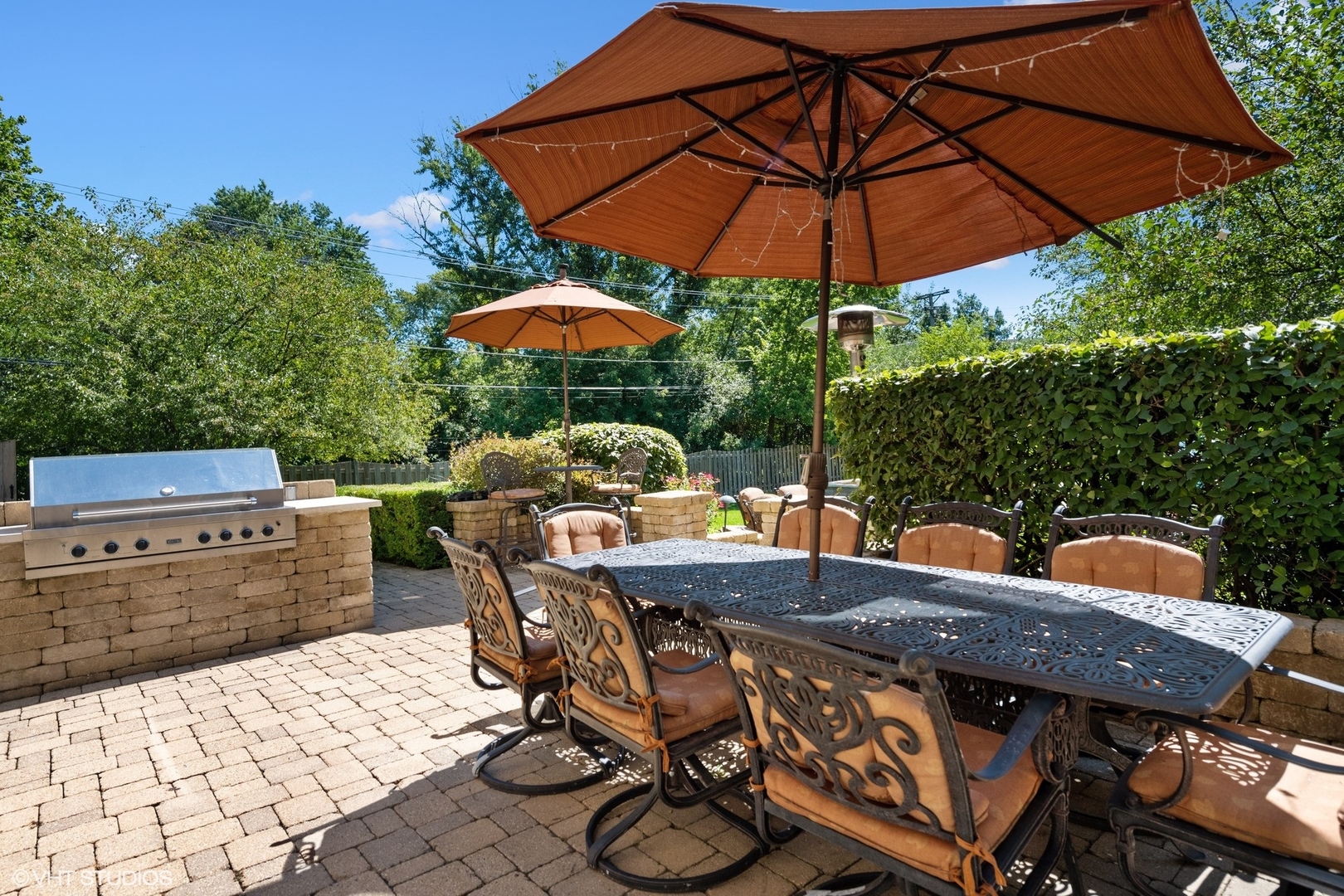 3825 Oak Avenue Northbrook, IL 60062 - Photo 39 of 56 a view of a patio with table and chairs under an umbrella