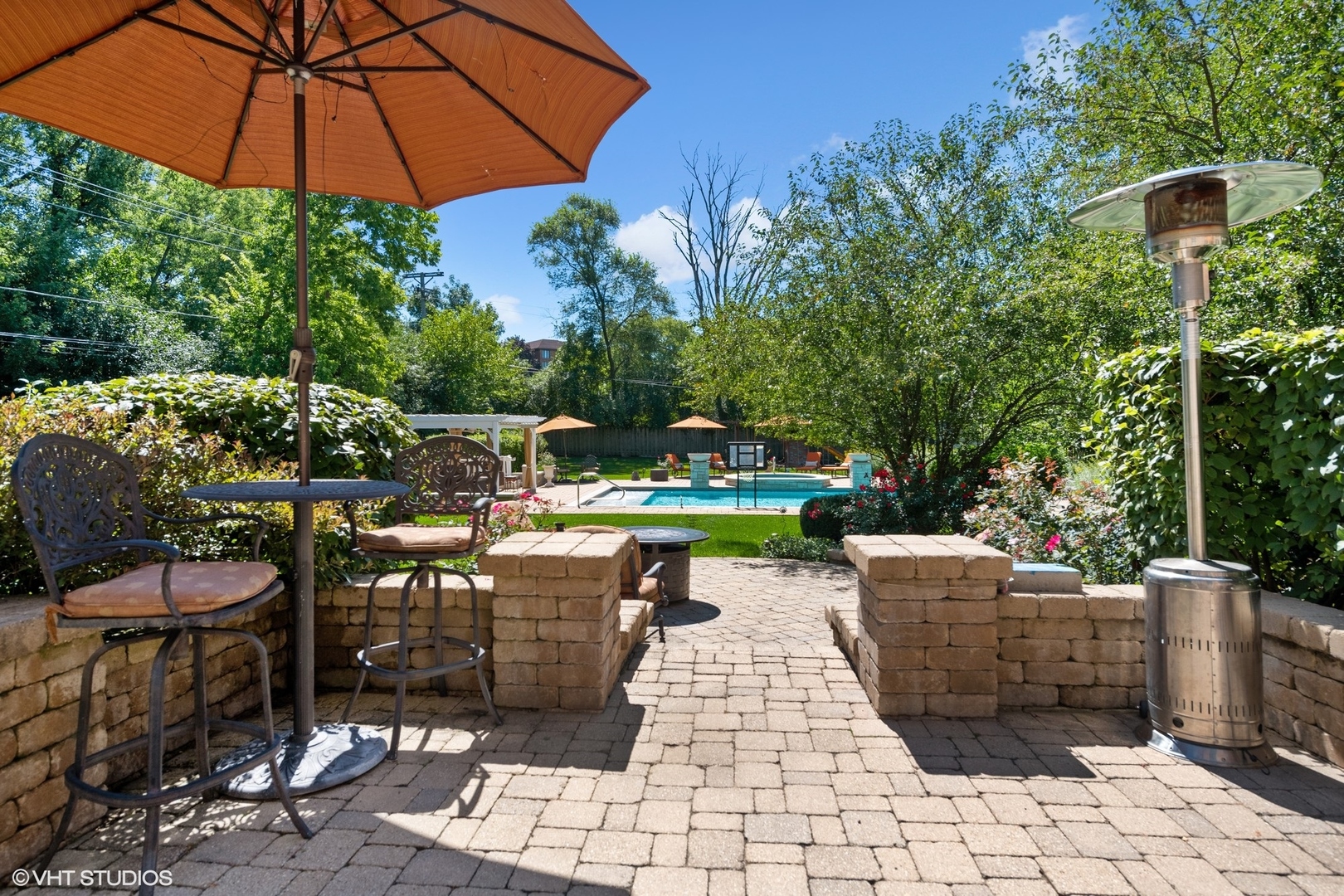 3825 Oak Avenue Northbrook, IL 60062 - Photo 40 of 56 a view of a chairs and table under an umbrella in backyard