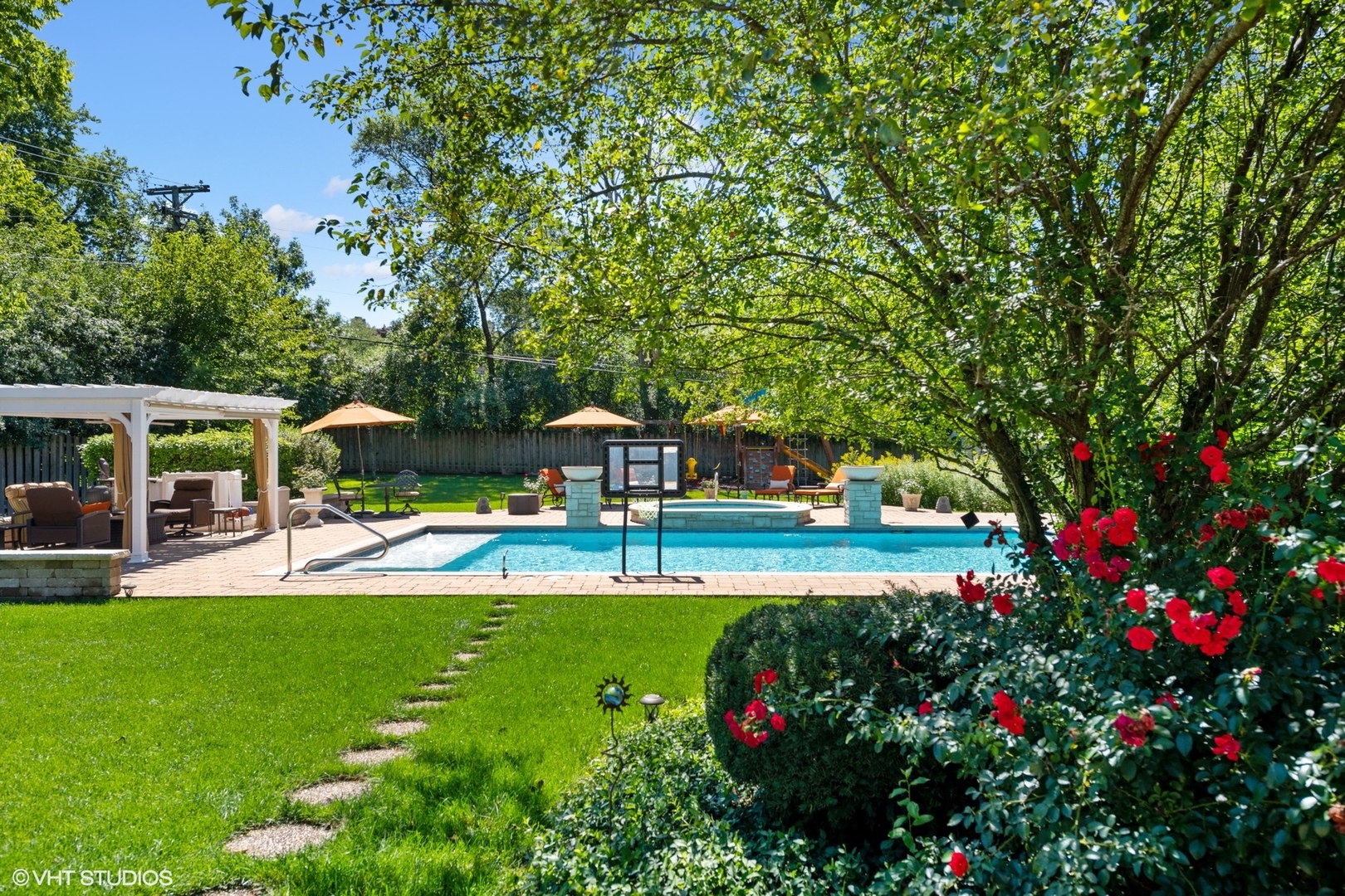 3825 Oak Avenue Northbrook, IL 60062 - Photo 42 of 56 a view of a swimming pool with lawn chairs and a big yard