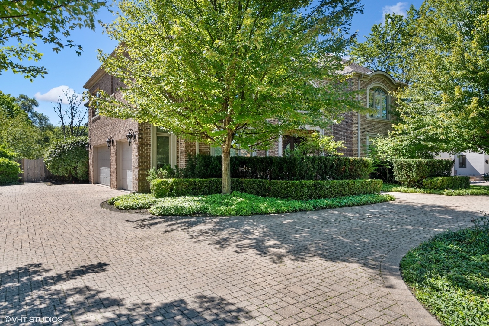 3825 Oak Avenue Northbrook, IL 60062 - Photo 52 of 56 a front view of a house with garden and trees