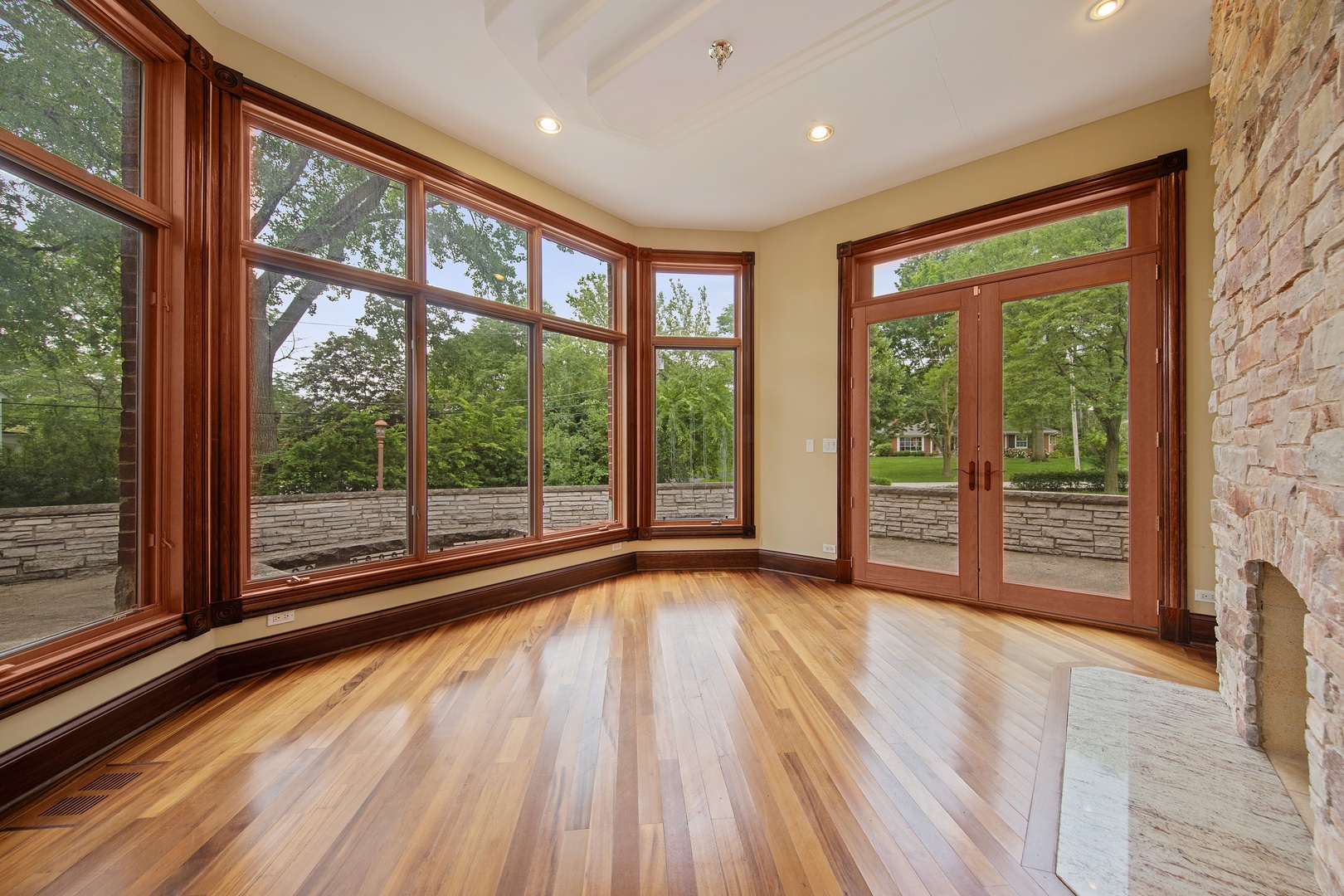 819 Wilson Lane Hinsdale, IL 60521 - Photo 14 of 26 a view of an empty room with wooden floor and a window