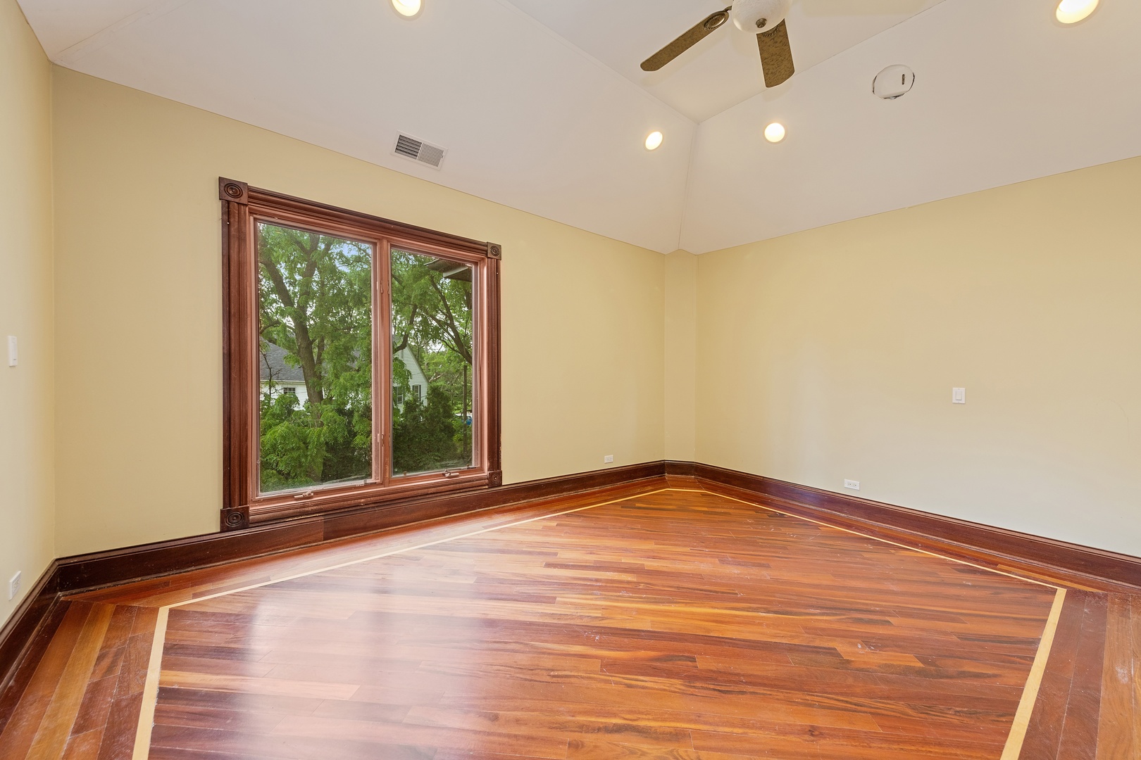 819 Wilson Lane Hinsdale, IL 60521 - Photo 19 of 26 a view of an empty room with wooden floor and a window