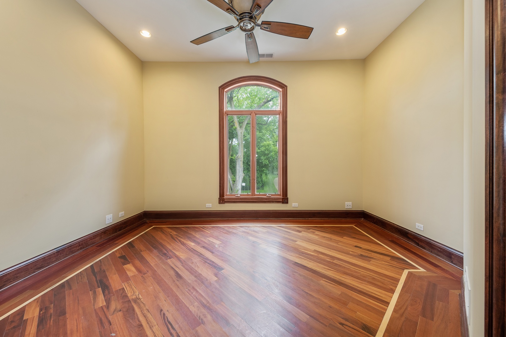 819 Wilson Lane Hinsdale, IL 60521 - Photo 20 of 26 a view of a room with wooden floors and ceiling fan