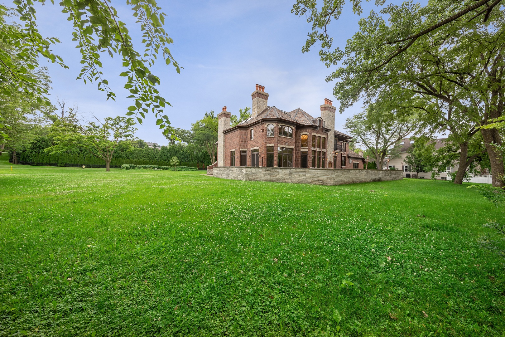 819 Wilson Lane Hinsdale, IL 60521 - Photo 26 of 26 a front view of a house with a garden