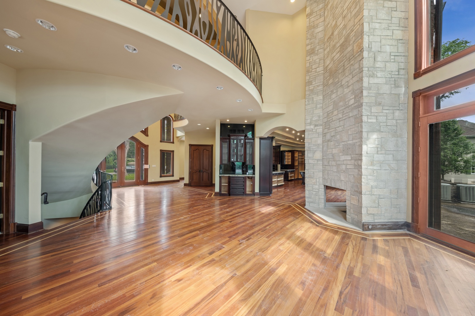 819 Wilson Lane Hinsdale, IL 60521 - Photo 6 of 26 a view of a livingroom with wooden floor and stairs
