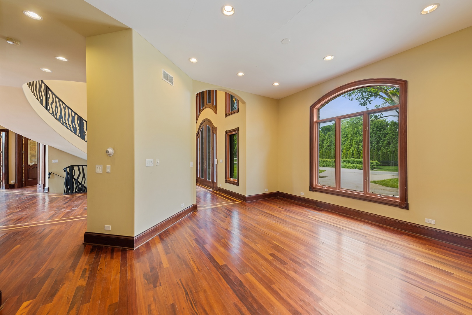 819 Wilson Lane Hinsdale, IL 60521 - Photo 7 of 26 a view of a big room with wooden floor and windows