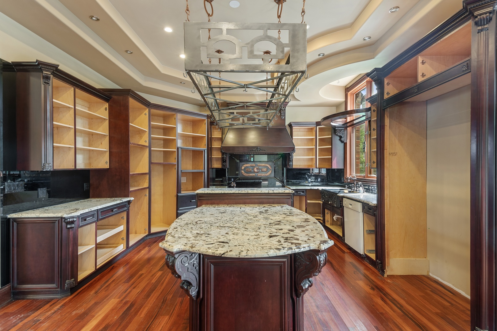 819 Wilson Lane Hinsdale, IL 60521 - Photo 8 of 26 a view of a kitchen with kitchen island a sink wooden floor and stainless steel appliances