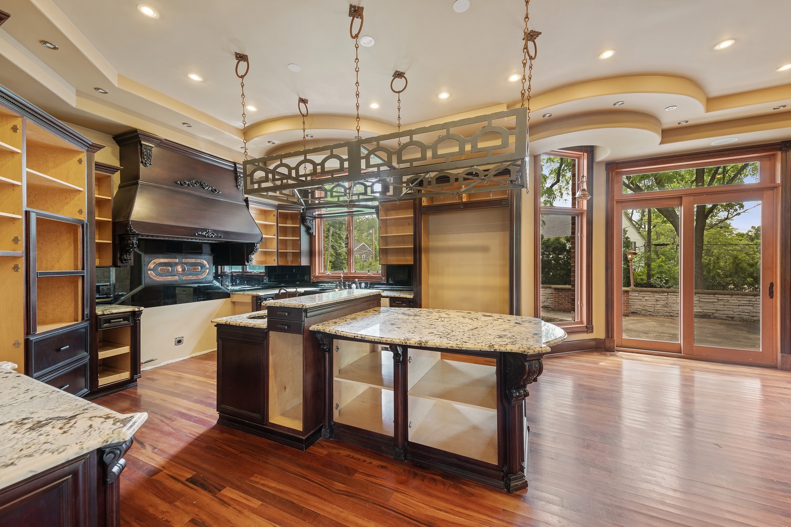 819 Wilson Lane Hinsdale, IL 60521 - Photo 9 of 26 a kitchen with stainless steel appliances granite countertop a sink a stove and a wooden floors