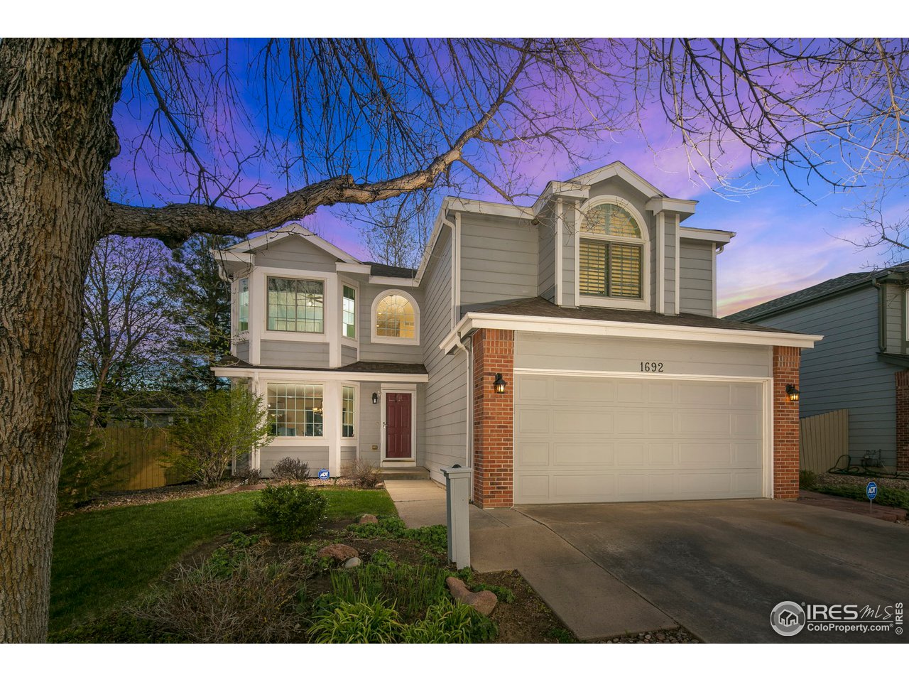 1692 Eldorado Drive Superior, CO 80027 - Photo 1 of 34 a front view of a house with garden