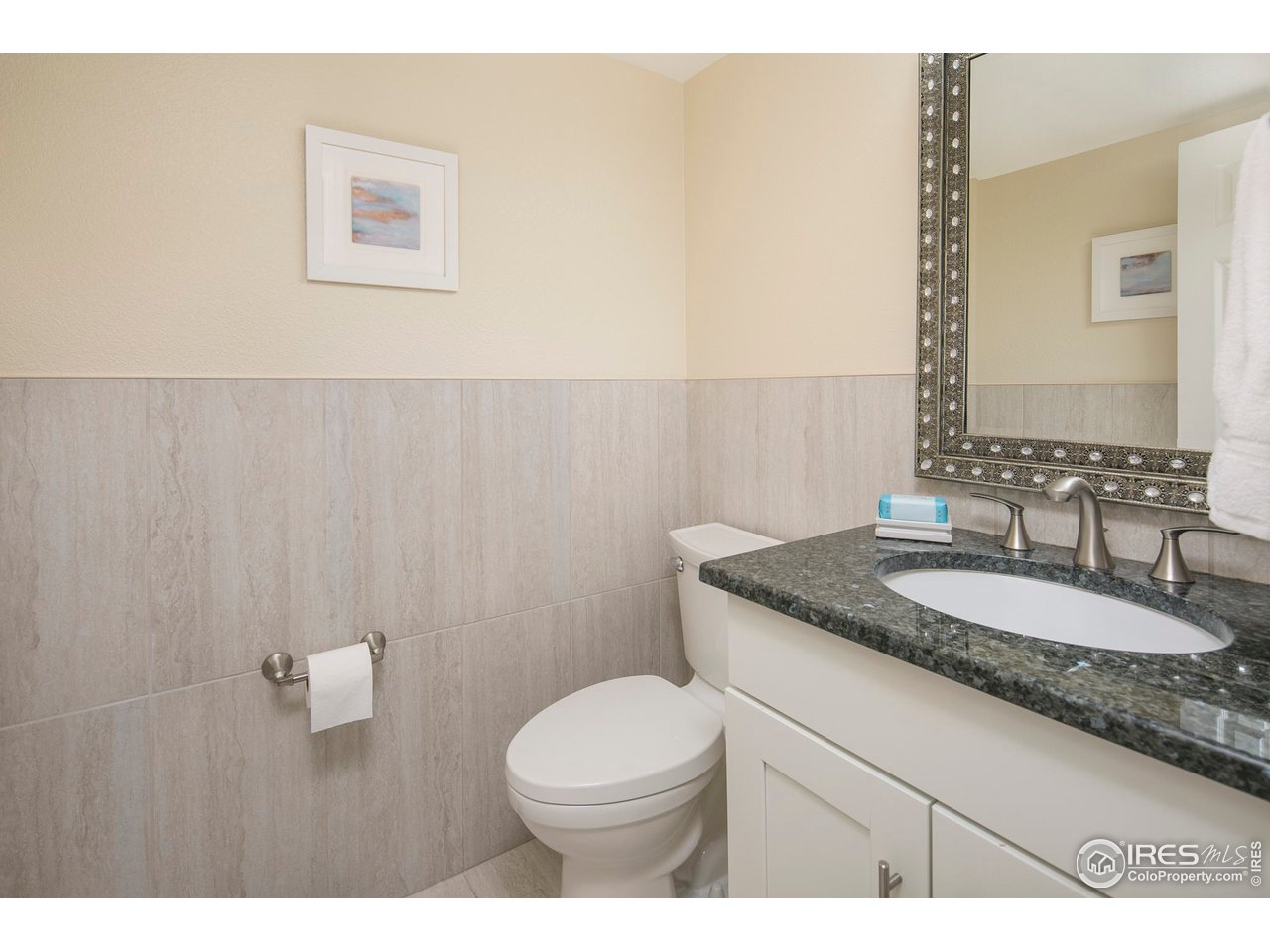 1692 Eldorado Drive Superior, CO 80027 - Photo 14 of 34 a bathroom with a granite countertop sink a toilet and a mirror