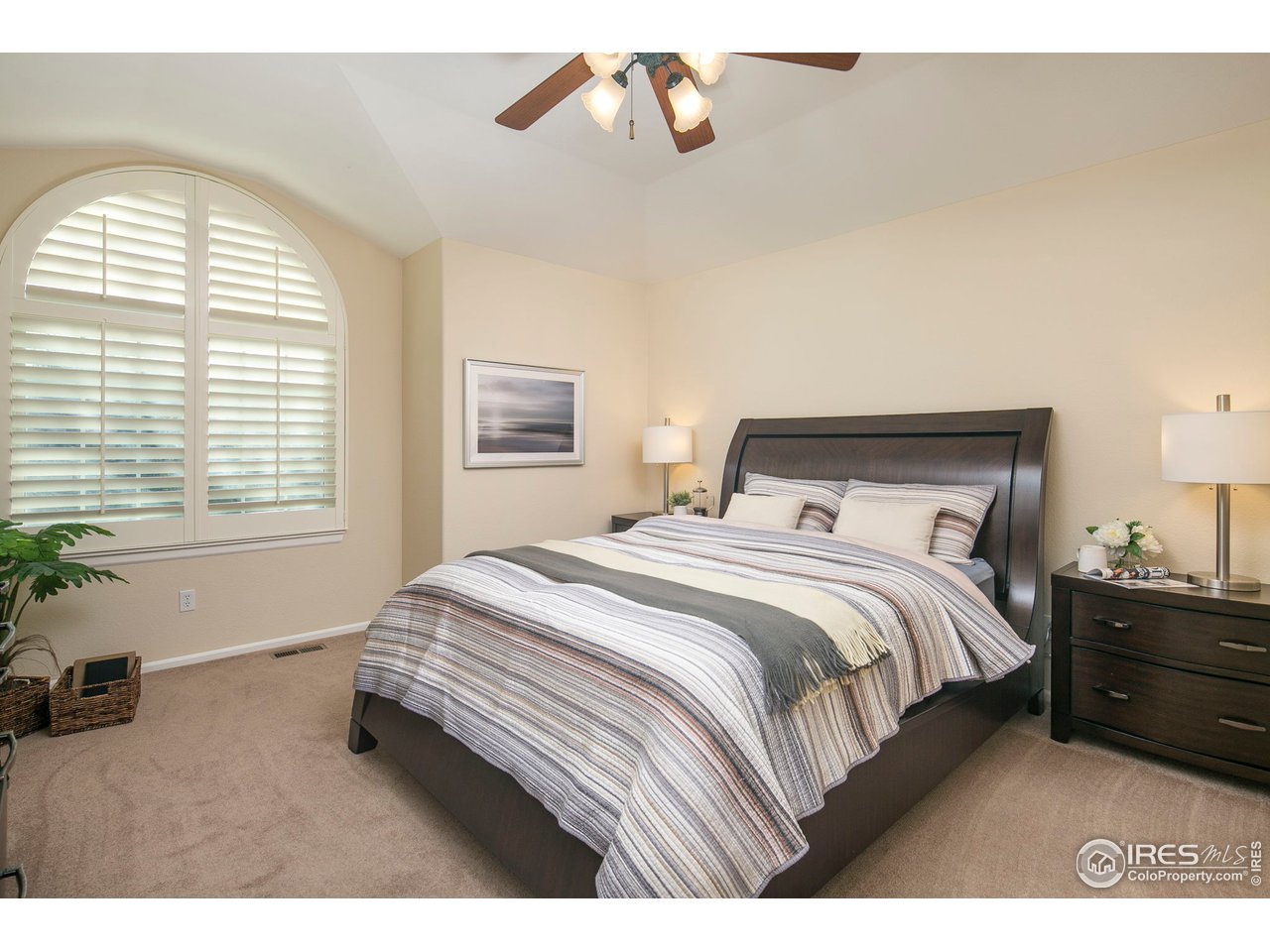 1692 Eldorado Drive Superior, CO 80027 - Photo 16 of 34 a bedroom with a bed a dresser next to a window