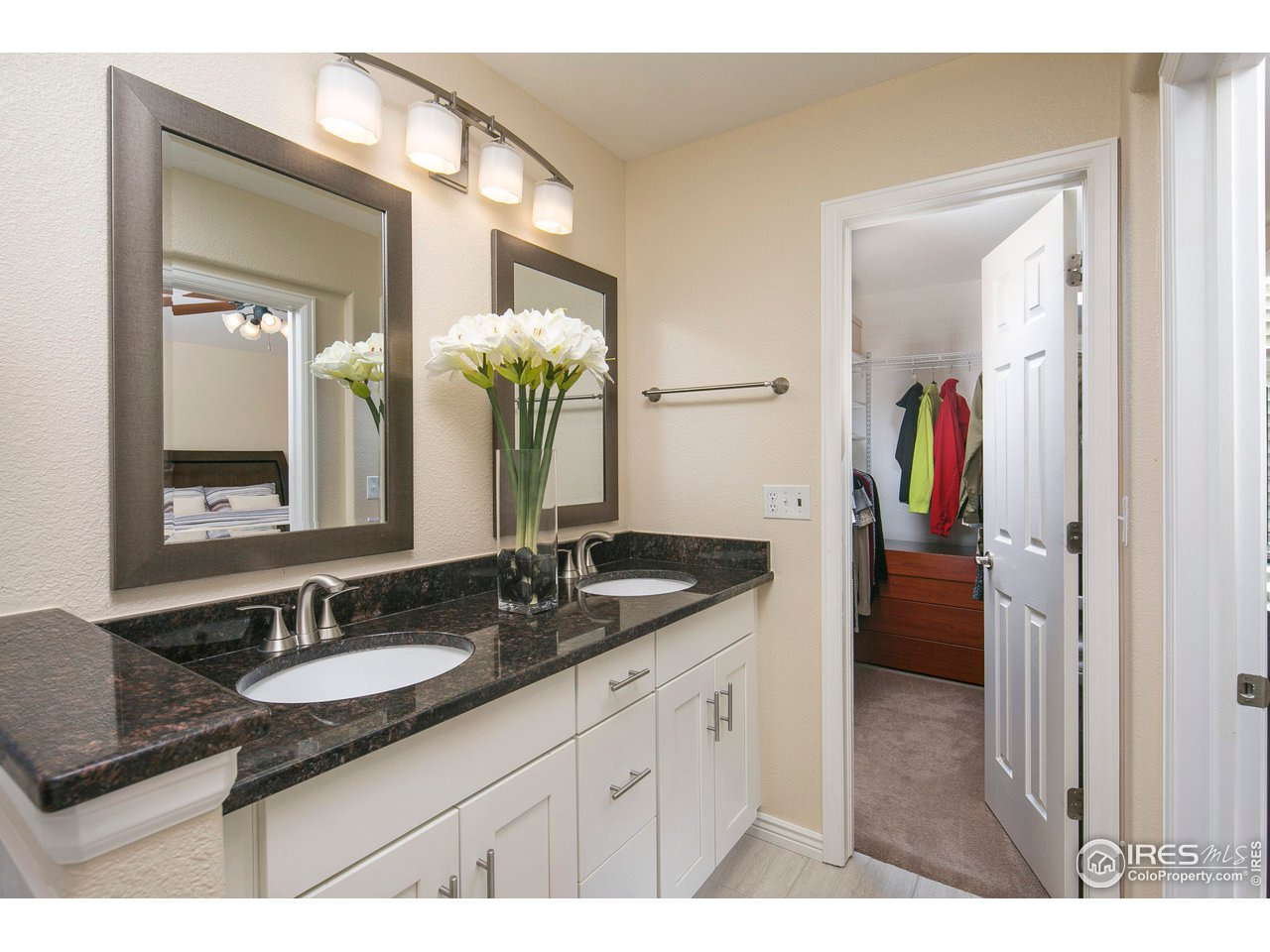 1692 Eldorado Drive Superior, CO 80027 - Photo 18 of 34 a en suite bathroom with a granite countertop sink and a mirror