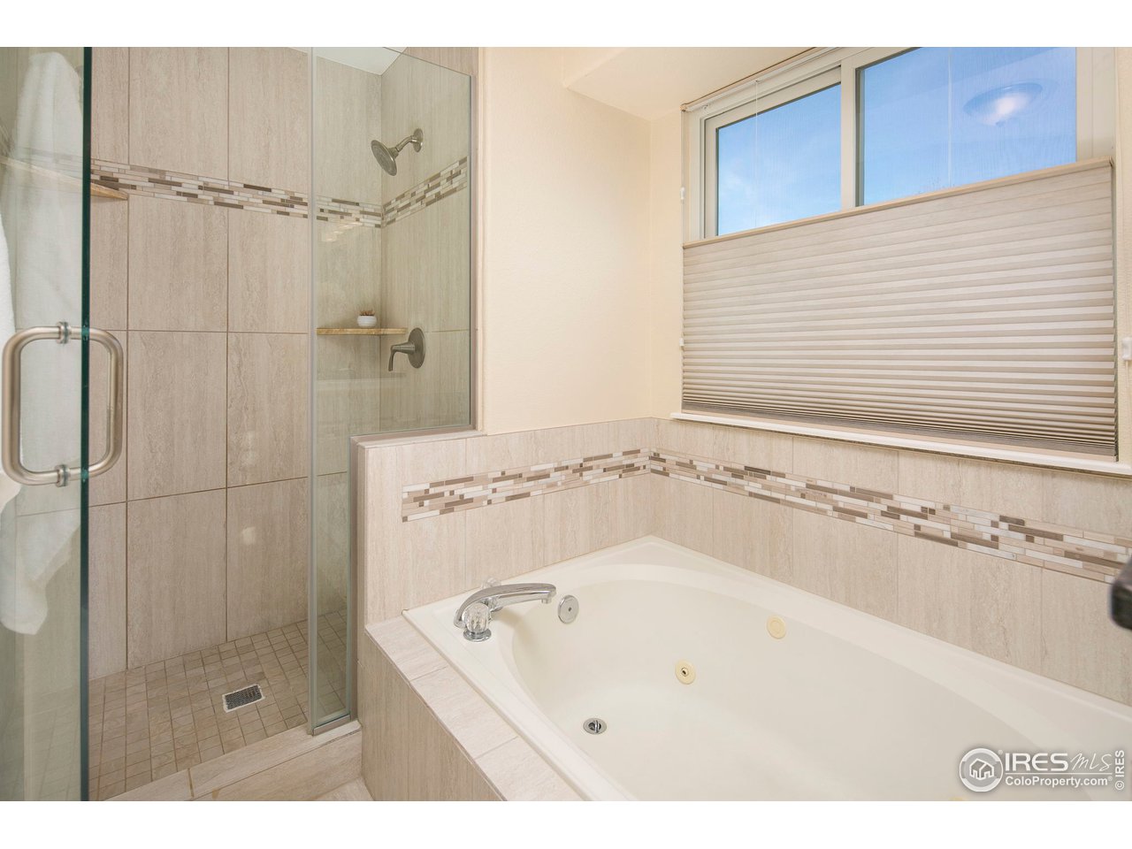 1692 Eldorado Drive Superior, CO 80027 - Photo 19 of 34 a bathroom with a bathtub and a shower