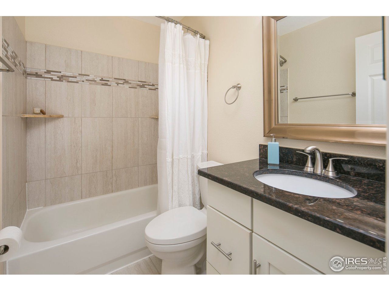 1692 Eldorado Drive Superior, CO 80027 - Photo 23 of 34 a bathroom with a granite countertop sink toilet and shower
