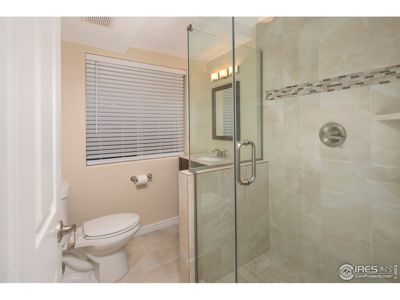 1692 Eldorado Drive Superior, CO 80027 - Photo 26 of 34 a bathroom with a toilet a sink and shower
