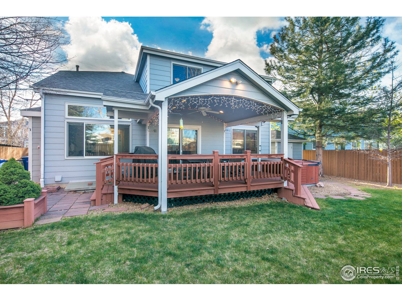 1692 Eldorado Drive Superior, CO 80027 - Photo 28 of 34 a view of a house with a backyard and deck