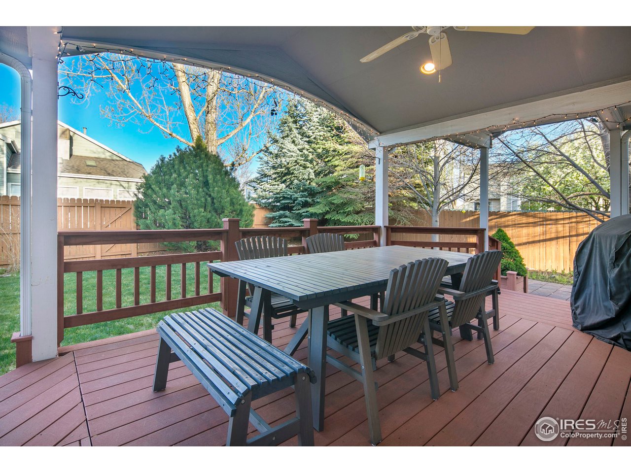 1692 Eldorado Drive Superior, CO 80027 - Photo 31 of 34 a view of a patio with wooden floor and outdoor seating