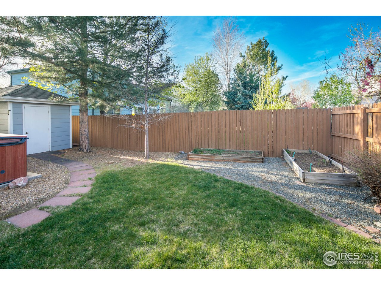 1692 Eldorado Drive Superior, CO 80027 - Photo 33 of 34 a view of a backyard with a small cabin and a chair
