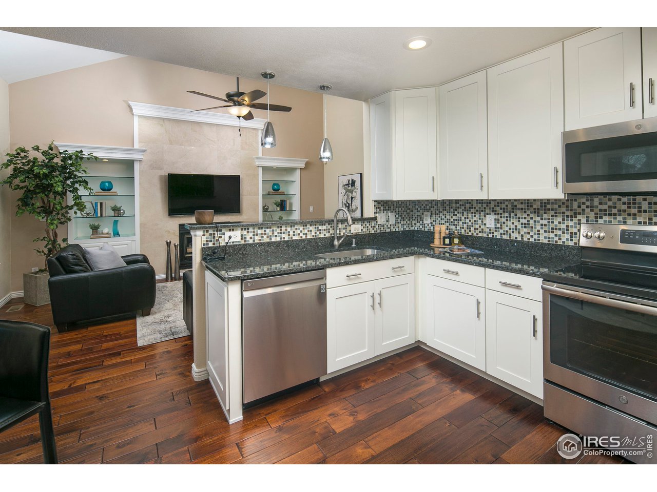 1692 Eldorado Drive Superior, CO 80027 - Photo 10 of 34 a kitchen with a sink stove and microwave