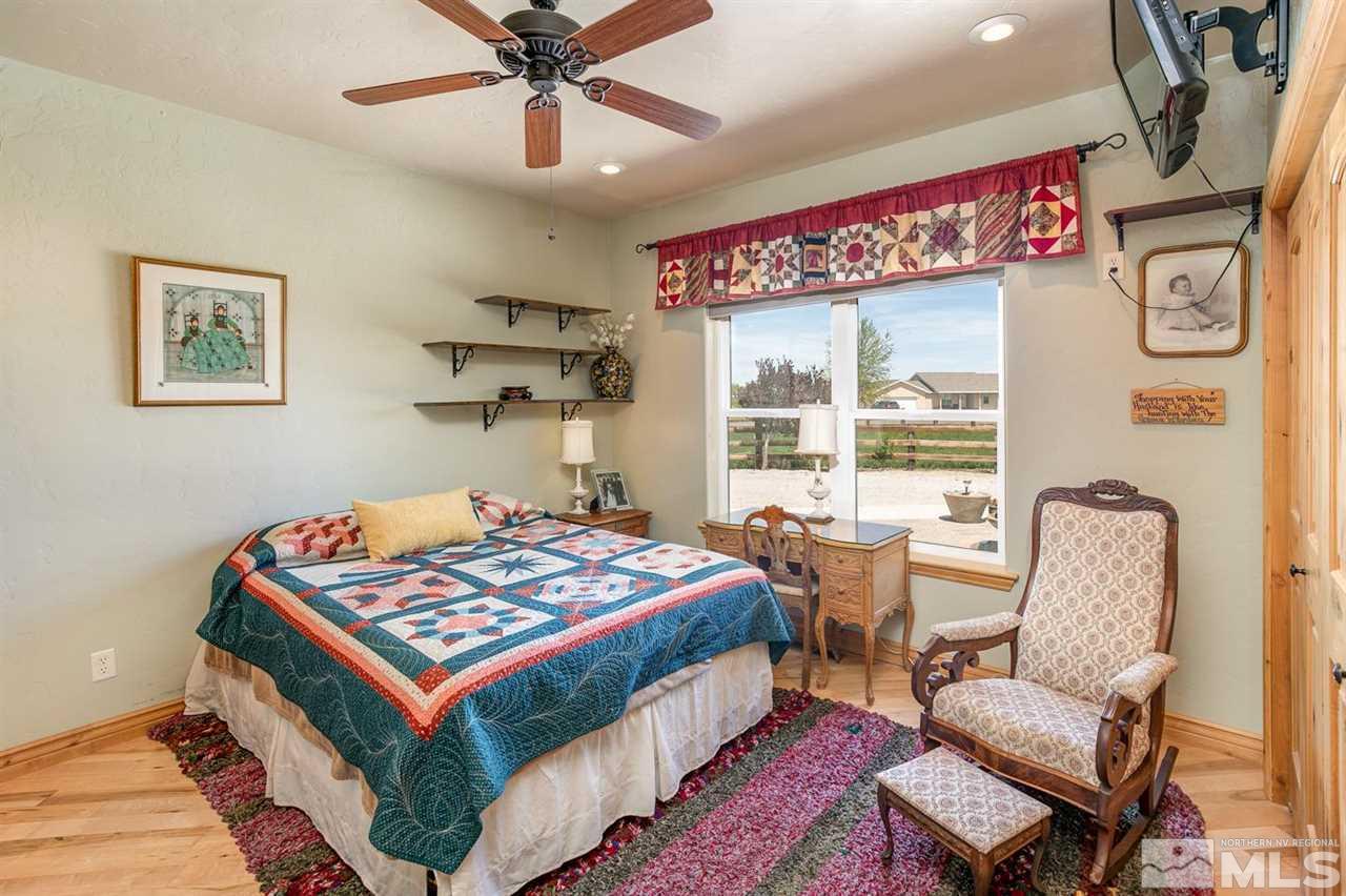 3500 South Allen Road Fallon, NV 89406 - Photo 18 of 40 a bed room with a bed and chair