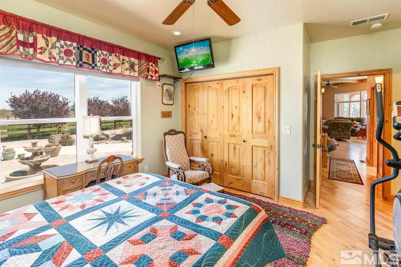 3500 South Allen Road Fallon, NV 89406 - Photo 20 of 40 a bedroom with a bed and large windows
