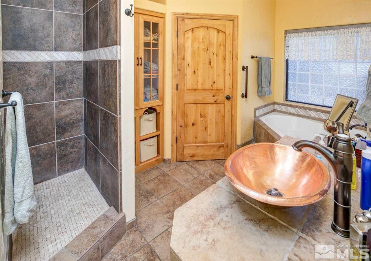 3500 South Allen Road Fallon, NV 89406 - Photo 26 of 40 a view of a bathroom with a sink and mirror