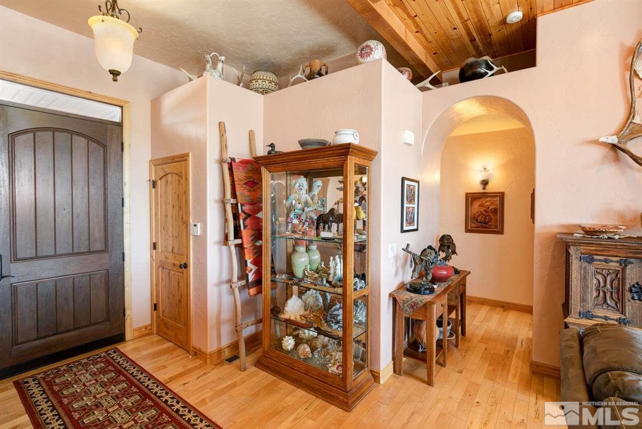 3500 South Allen Road Fallon, NV 89406 - Photo 5 of 40 a view of a hallway with wooden floor