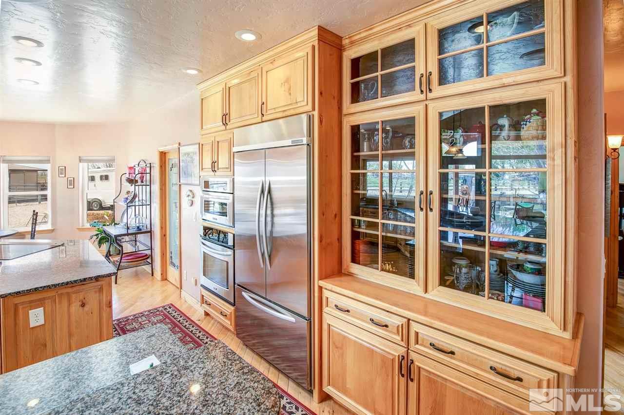 3500 South Allen Road Fallon, NV 89406 - Photo 8 of 40 a view of a kitchen with stainless steel appliances granite countertop a refrigerator and a sink