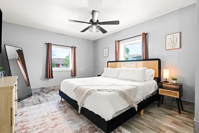 a bedroom with bed and window